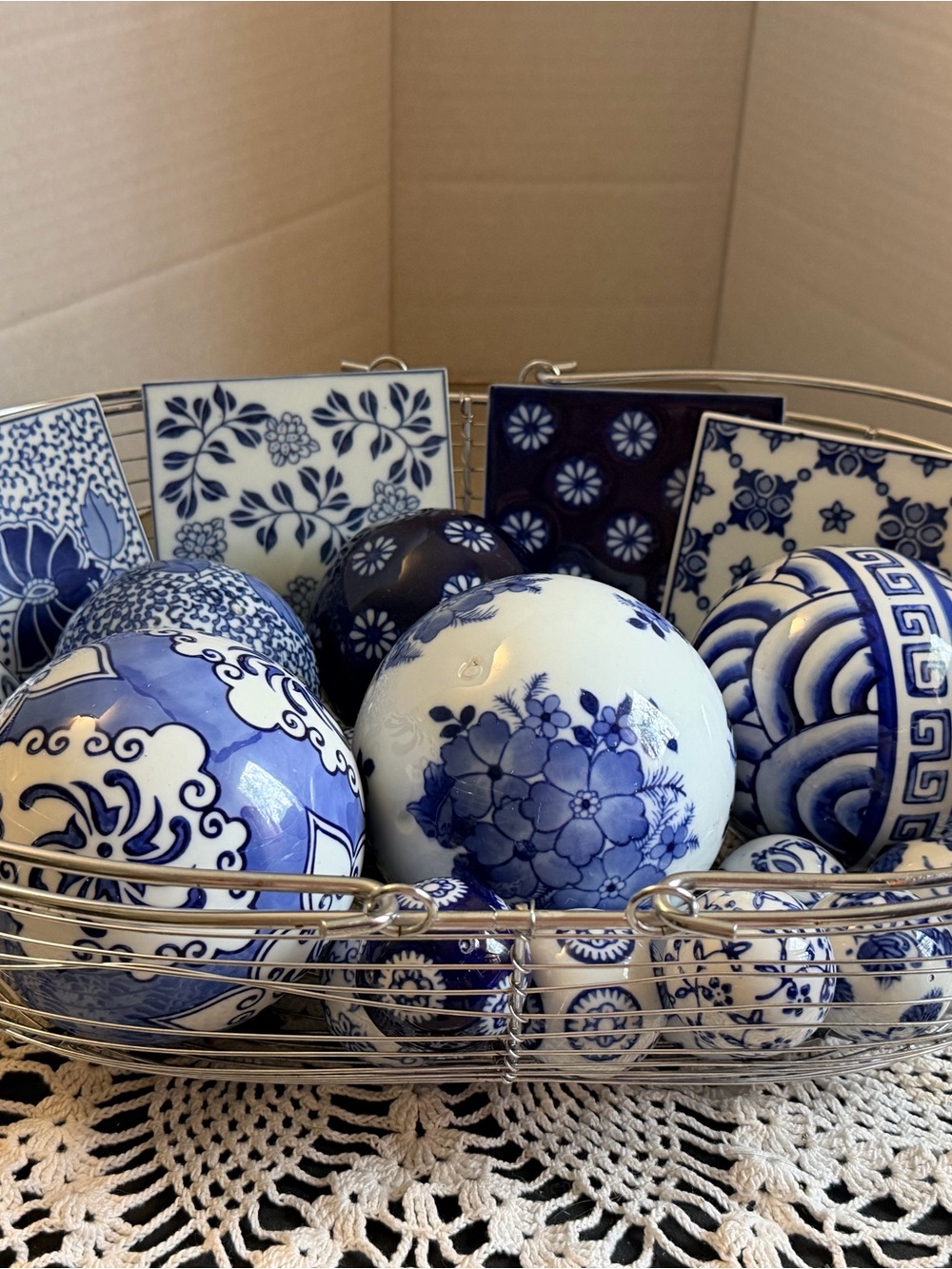 Blue & White Carpet Balls, 2 Lg, 2 med., 10 sm and 6 coasters & silver basket